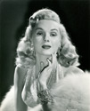 Lovely Adele Jergens, described as "the champagne blonde" by her fans, plays an important part with George Brent and Joan Blondell in Columbia's new mystery spine-tingler, Director Henry Levin's film, "The Corpse Came C.O.D.", 1947. Famed costume designer Jean Louis created Miss Jergen's gowns for the film.