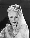 An in-costume portrait of Adele Jergens to support her role as Princess Armina in Columbia Studios "A Thousand and One Nights", 1945. Princess Armina happens to be the daughter of the reigning Sultan Kamar-Al-Kir who later becomes the object of Alladin's desire. His plans are foiled, even with the help of Genie Babs, played by Evelyn Keyes, when the Sultan's evil twin brother gets involved. Director Alfed E. Green's adventure fantasy, "A Thousand and One Nights", 1945. 