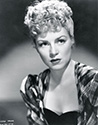 A character pose of Claire Trevor as the outcast girl for John Ford's Stagecoach, 1939.