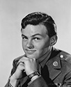 This portrait of Conrad Janis reveals much about his screen character of Ronald Stevens, a young Marine Corps war hero who enlisted while under legal age in WWII. After mustering out of the Corps as a decorated veteran, Ronald returns home to civilian life at age 16 to find himself confronting a series of funny and completely unexpected woes. This was Conrad Janis’ first foray into the world of Hollywood acting, having worked previously on the Broadway stage in youth roles. Conrad has had a long and varied career since then with credits in directing, editing, producing, casting, soundtrack and acting. Director Jack Moss' wartime comedy, "Snafu", 1945.