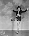 Evelyn Keyes in a dance move from Columbia Studios' film, "The Jolson Story", 1946. Evelyn plays Julie Benson, a star of Jolson's theatrical shows. Julia and Jolson eventually get married and move to the country. The performer in Jolson ulitmately overwhelms the husband he has become, and Julie is faced with marriage with a man who would rather be performing on stage than being husband to her. Director Alfred E. Green's biographical musical drama, "The Jolson Story", 1946.