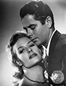 Playing a conniving small town waitress, Janis Carter manipulates Glenn Ford, a visiting mining engineer, to help her accomplish her plans to escape small town drudgery while at the same time embezzling piles of cash. Columbia Pictures film noir drama, "Framed” directed by Richard Wallace, 1947.