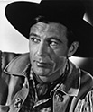 Perpetual saddle tramp Cole Harden, played by Gary Cooper in this portrait, functions as a counterfoil for self appointed hanging Judge Roy Bean, played by Walter Brennan, in a small Texas community where free-range cattle interests clash with homesteaders who have moved into the area. William Wyler’s romantic Western drama, 'The Westerner', 1940.