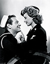 Janet Blair and Al Drake, as Christine Bradley and Howard Young, share a romantic moment in Director Alfred E. Green's wartime musical and dance production, "Tars and Spars", 1946.