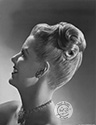 Janis Carter poses for this elegant fashion image to promote her Columbia Studios films she worked in the mid-1940's. 