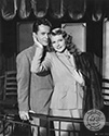 Larry Parks and Rita Hayworth share an intimate gesture in Columbia Studios' 1947 musical extravaganza, "Down To Earth”, directed by Alexander Hall.