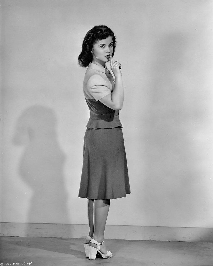 A portrait of Shirley Temple as she appears as Corliss Archer, an unwitting temptress, in Director Richard Wallace’s romantic comedy, "Kiss and Tell”, 1945.