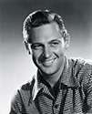 A studio portrait of William Holden to support his role as Del Stewart in a period piece about difficultes suffered by Union War veterans. Del and Owen Devereaux (Glenn Ford) are friends from the war who, having gone their separate ways for a time, reunite in the West. By that time, Owen has developed severe psychlogical problems stemming from the brutality of the war. The plot captures the efforts of Del to help his old friend cope with his problems. Director Henry Levin's Western thriller, "The Man From Colorado", 1