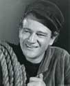 The Long Voyae Home photos: John Wayne as seaman Ole, crew member aboard S.S. Glencairn during a perilous voyage in Director John Ford's epic drama of the sea, 'The Long Voyage Home', 1941. Studio caption for this photograph reads: John Wayne, popular young leading man, who has another unusually fine role under the director who made him famous in "Sagecoach", John Ford. Wayne has the part of a Swedish sailor in Ford's Argosy production of "The Long Voyage Home" adapted from Eugene O'Neill's classics."