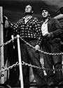 Ian Hunter as the mysterious Smitty and Thomas Mitchell as ship's bosun Driscoll scan the horizon from the deck of the SS Glencairn in John Ford's 'Long 'Voyage Home', 1940