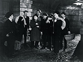 The crew of the S.S. Glencairn gathers in a dockside alley the evening before they depart on their hazardous journey in John Ford's The Long Voyage Home, 1940