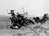 Yak Canutt, the ultimate stuntman, takes a spill with his horse during a chase scene in the film Stagecoach