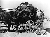 Stagecoach 1939 film: George Bancroft as U.S. Marshall Curly Wicox confronts John Wayne who plays the escaped prisoner, Ringo Kid, on the road in Walter Wanger's "Stagecoach". 