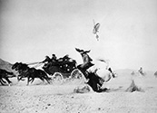 Navajo Indians participated in this attack scene to lend authenticity to the action. Residents of the region, they were recruited to portray Apache warriors who performed raids just like this under Chief Geronimo’s command in the 1870’s. Ned Scott was praised for his grasp of the action scenes because he had positioned himself just right to capture headlong spills such as this one from a galloping horse. John Ford’s Stagecoach', 1939.