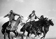 A close-up of Navajo Indians, portraying attacking Apache warriors, ride to intercept the Overland Stage as it tries to evade a raiding party. John Ford’s ‘ Stagecoach”, 1939.