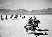 A full retinue of attacking Apache warriors rides to intercept the Overland Stage in a raid directed by Geronimo who was terrorizing the region at the time. John Ford’s ‘Stagecoach’, 1939.