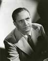 Fredric March photos: Quoting from the caption attached to this photograph: C-starring in Walter Wanger's "Trade Winds" prior to his return to the New York stage, Fredric March is completing an important page in histrionic versatility. March has played in more outstanding hit films than any other screen star and in is 41 screen pays has portrayed a wider range of characters than any other film player. In "Trade Winds", associates say, March is more himself than any other role he has yet assumed." A portrait for Director Tay Garnett's lighthearted detective mystery, "Trade Winds" 1938.