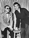 Photos of Jimmy Stewart: Jimmy relaxes off-set with Carlos Fernandez, renowned Big Band leader in the 1940’s. Jimmy Stewart plays the role of Jimmy Haskel, a music aficionado who has just failed in a music business venture. Hat in hand, he goes to work for his uptight uncle, C.J. Haskel, played by Charles Winniger, who owns a health food business. Along the way, he befriends an Irish family who are music lovers and have their own band. The daughter in the family, Molly McKorkle, played by Paulette Goddard, comes to Jimmy’s notice and they become friends because she encourages him in his music talents (harmonica playing). Things get interesting when romance begins to bloom in their relationship despite the stern rumblings of a Molly’s overprotective mother, Ma Mckorkle, played by Mary Gordon. Director George Marshall’s musical romantic comedy, "Pot O’ Gold", 1941.