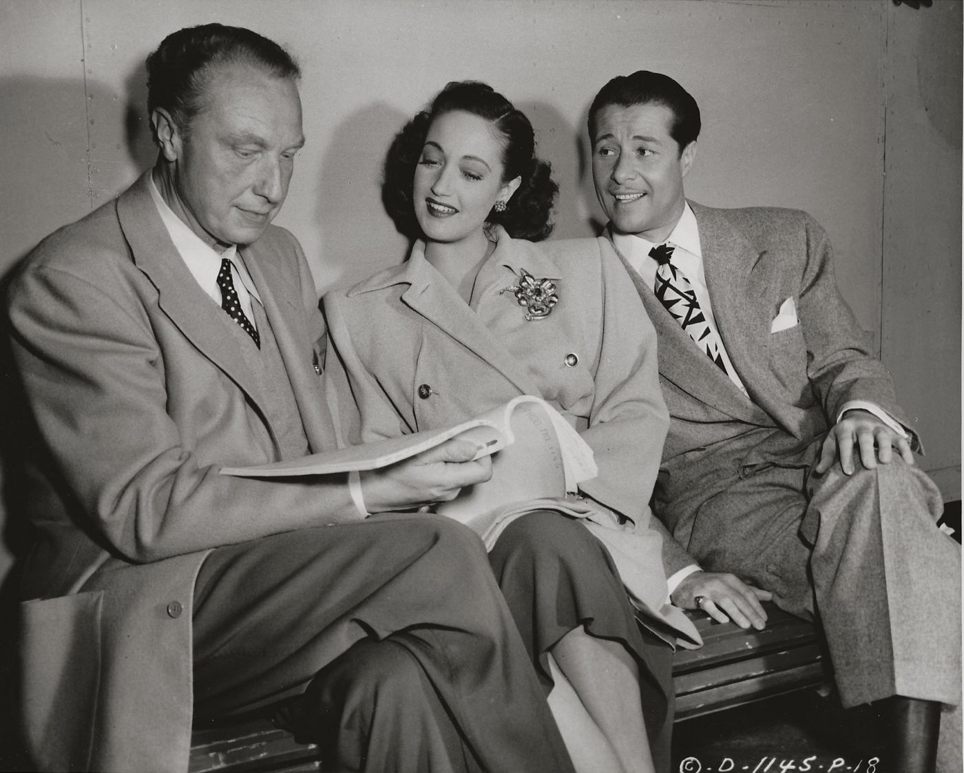 Director Douglas Sirk and actors