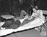Director Josef von Sternberg and Ona Munson, sharing a quiet moment of rest during filming of "The Shanghai Gesture", 1941.