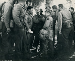 Ernie Pyle (played by Burgess Meredith)wisecracks with officers and men in a light moment at one of the camps at the front.Ernie Pyle (played by Burgess Meredith) wisecracks fighting men in a light moment at one of the camps at the front. From left to right, the G.I.'s are: Pvt. Angleo Arena, Jack Reilly, Bill Murphy, Freddie Steele, Wally Cassell, Pvt. Jim Peters, William Benedict, Pvt. Bill Jacoby, Jimmie Lloyd, Pvt. Louis Casso, and Pvt John Duffy. Scene from Lester Cowan's authentic wartime drama 'The Story of G.I. Joe.' 1945