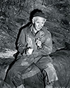 There's nothing like a cigarette to comfort the battle weary war correspondent in The Story of G.I. Joe. Burgess Meredith as Ernie Pyle gets ready to light up during a tough day at the front. No cigarettes were allowed at night due to the ever vigilant enemy artillery spotters who would quickly zone in on such a target. According to Lee Miller in his 1946 book, An Ernie Pyle Album, Ernie always wore a woven hat identical to this one out in the field.