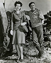 Cadet Nurse Beulah Tyler gets an earful from Burgess Meredith who plays the role of Ernie Pyle in The Story of G.I. Joe. 