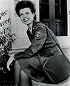 Cadet Nurse Beulah Tyler poses for Ned Scott in her official Corps uniform with regulaton patch in The Story of G.I. Joe.