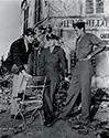 Ernie Pyle relaxes with Special Forces Army officers (Rangers), combat veterans of the D-Day Campaign, on the set of The Story of G.I. Joe.
