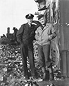 Ernie Pyle, here wearing his War Correspondent's uniform, relaxes with actor Burgess Meredith on the film set of "The Story of G.I. Joe." In the film Meredith plays the role of Ernie Pyle, decorated war correspondent, during the Allies drive to Rome after landing on the boot of the Italian Penninsula in WWII. Ernie stayed about three weeks on set while the film was in porduction, then he shipped out to the West Pacific where he ulitmately lost his life at the hands of a Japanese sniper. Director William Wellman's epic war drama "The Story of G.I. Joe", 1945.