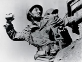 Robert Mitchum in his role as Capt. Henry Waskow prepares to throw a hand grenade at enemy positions in the film Story of G.I. Joe. This photograph is the talisman image of the film and it is found today in posters, DVD covers and publication headers for the film. 