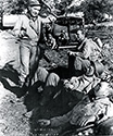 Burgess Meredith's character Ernie Pyle takes the chance to talk to soldiers as they rest briefly between combat duties at the Tunisian front, from The Story of G.I. Joe