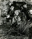 Combat at the front was spartan conditions, even brutal when cold weather hit. Burgess Meredith's character Ernie Pyle endures hardships at the front with his soldiers, from the Story of G.I. Joe. At the front, troops took advantage of any feature of the terrain to shelter themselves both from weather and from enemy aircraft and artillery action. 