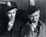 While working on the movie set, Ned Scott could always be found chewing on a match stick, an Ohio Bue Tip ,atch stick to be precise. And when he was not chewing on a stick, he was lighitng up and enjoying one of his Kent cigarettes. Ernie Pyle and Burgess Meredith decided to imitate Ned Scott with synchronous poses for this photograph. It was a light moment, one of many, and it speaks to the sense of comradery these men all felt toward one another on the set of Story of G.I. Joe.
